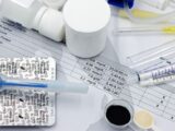 Vet supplies like syringes and medicines on blood test reports, suggesting medical care theme.